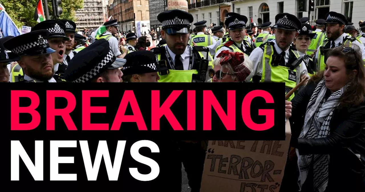 Protesters clash with police cordon after thousands march through London