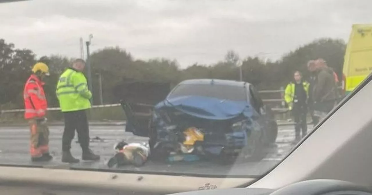 LIVE: M61 taped off after car bursts into flames with emergency services at scene