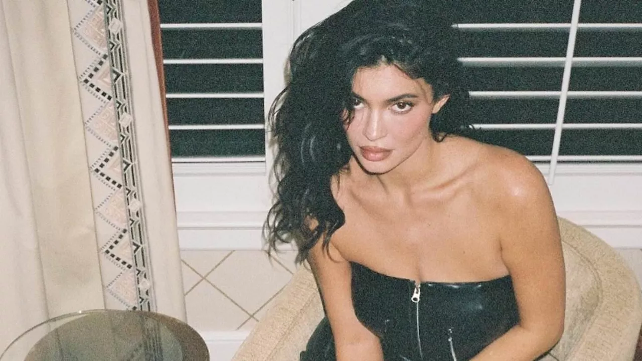 Kylie Jenner celebrates the one year anniversary of Khy in sexy black leather minidress while...