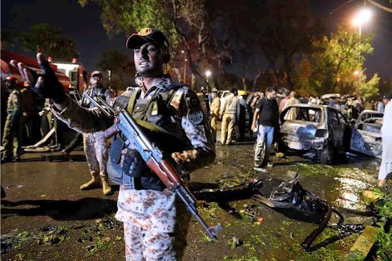 An explosion outside the Karachi, Pakistan, airport kills 2 workers from China and injures others