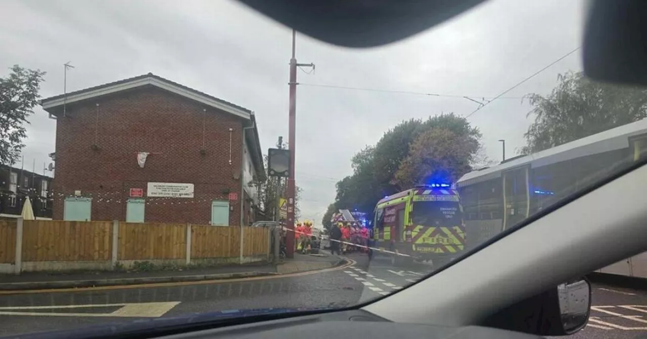 Man cut free from car by firefighters after tram crash