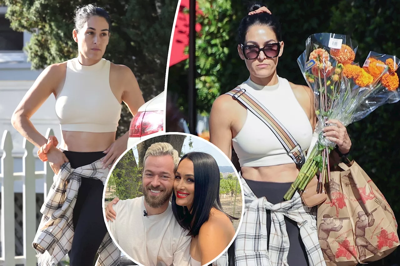 Nikki Garcia spotted buying herself flowers after getting restraining order against Artem Chigvintsev