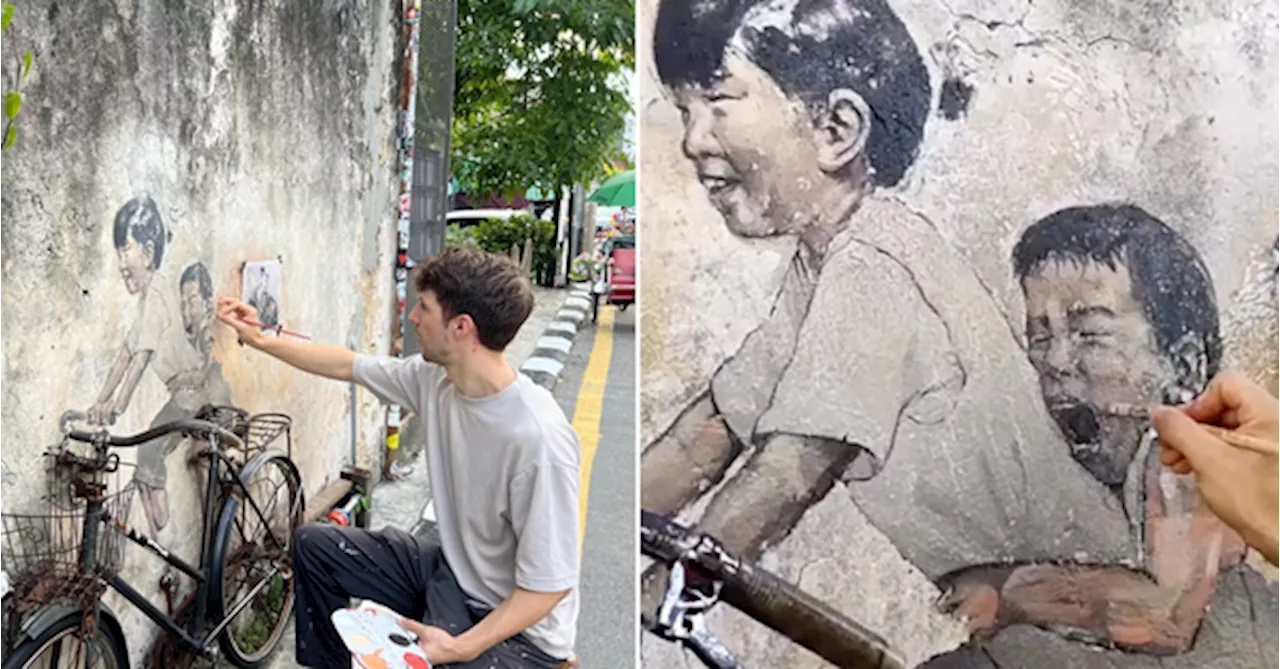 Artist Ernest Zacharevic Restores Beloved Penang Murals After 12 Years