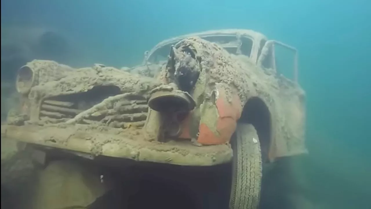 Underwater CAR GRAVEYARD where abandoned shells of 100s of classic motors are left to rot