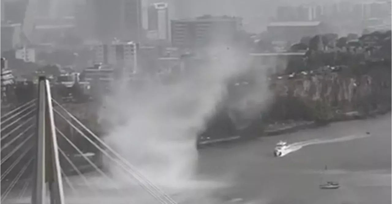 Incredible moment gustnado rips through Brisbane River during wild storm