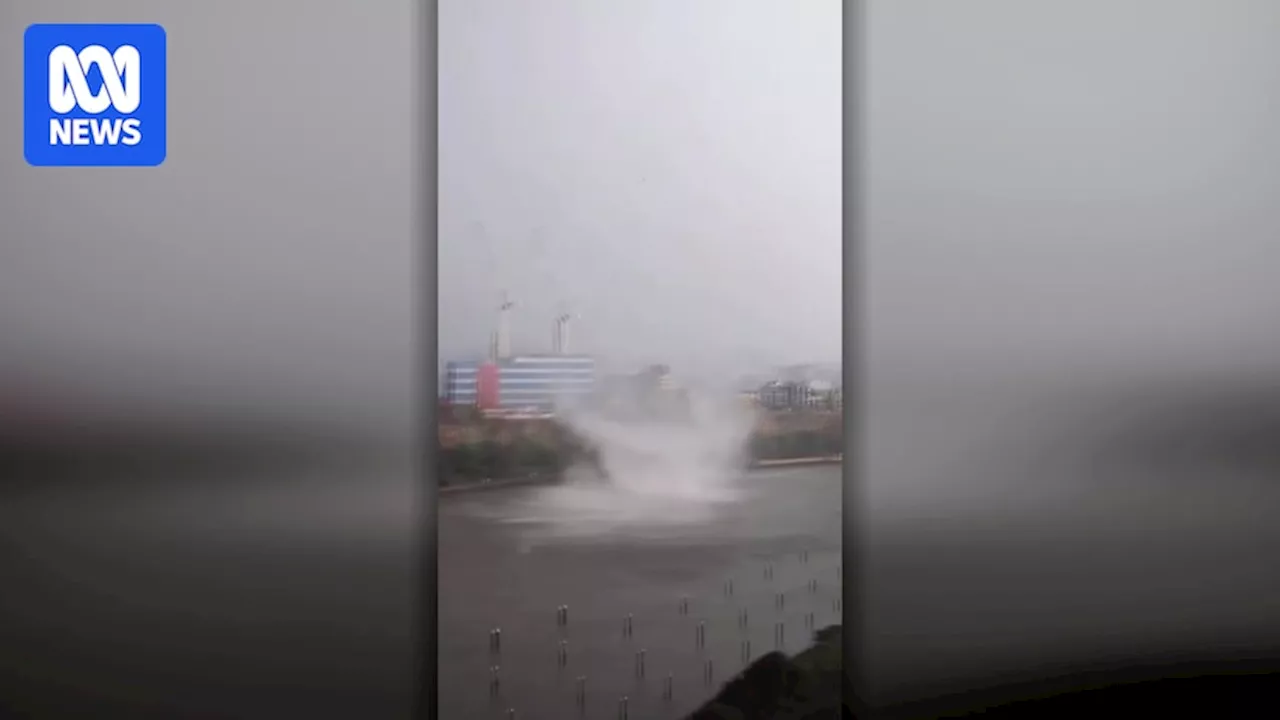 Water spout forms on the Brisbane River as supercell thunderstorm brings hail to city