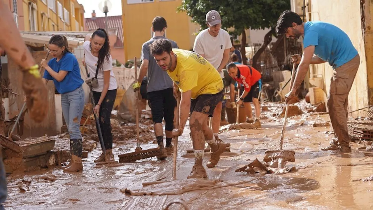 Mud-caked volunteers battle aftermath of Spain's deadliest flood, at least 205 dead