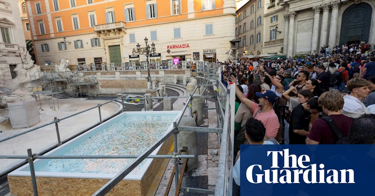 ‘A municipal swimming pool’: tourists react to temporary Trevi fountain replacement