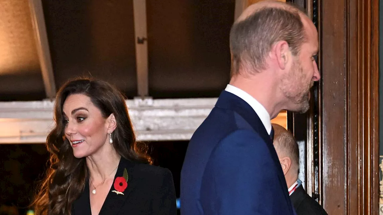 Prince William puts a comforting arm around Kate Middleton as they arrive at the Festival of...