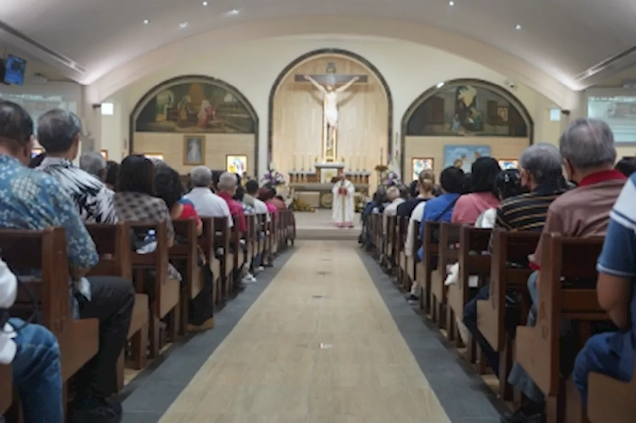 Catholic priest stabbed in Singapore church stable and recovering, Sunday mass proceeds as usual