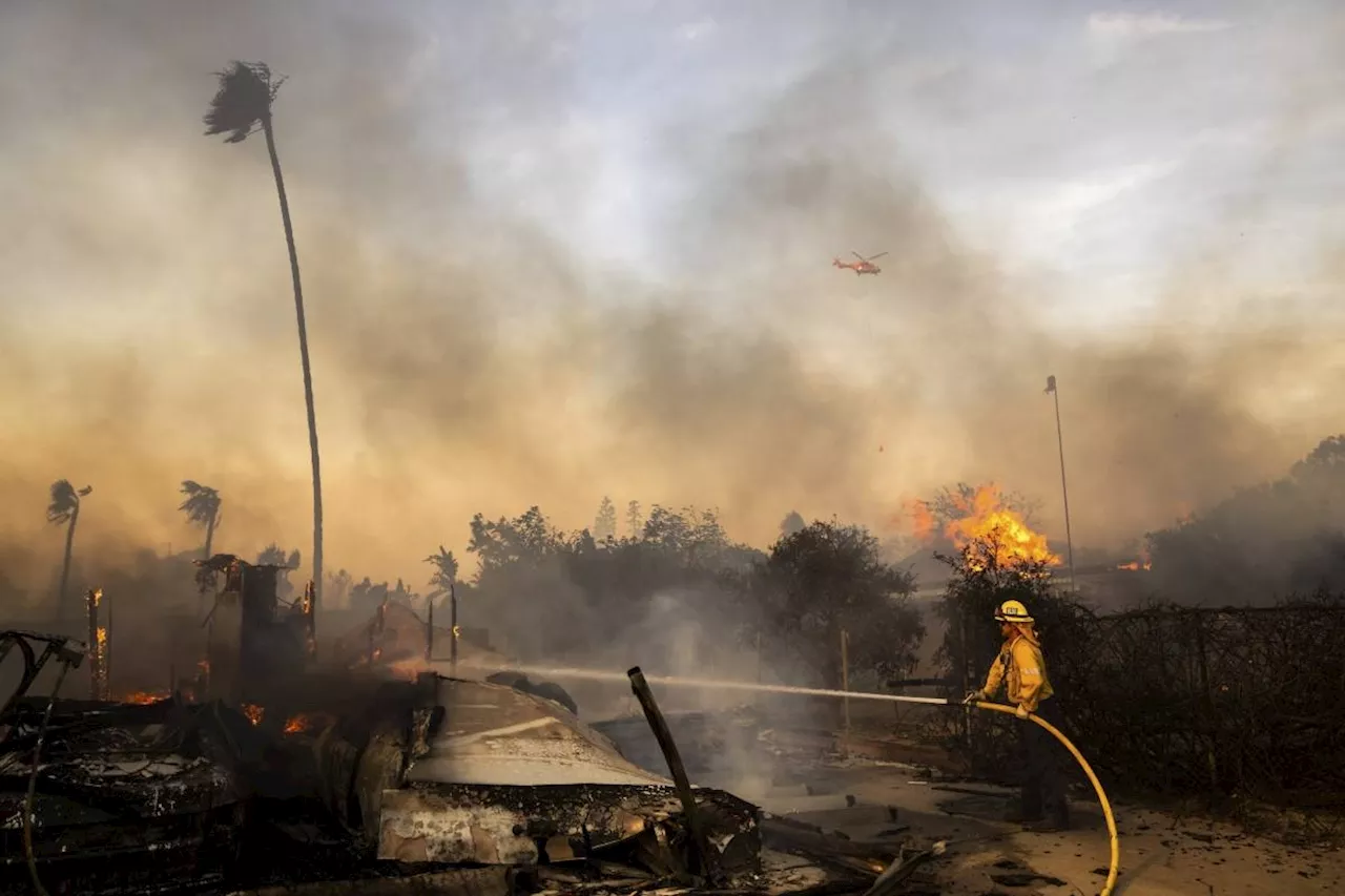 Firefighters advance on destructive blaze in California, aided by slower winds