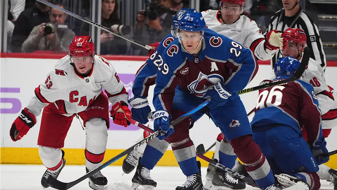 Avalanche score five goals in second period and end Hurricanes' eight-game win streak