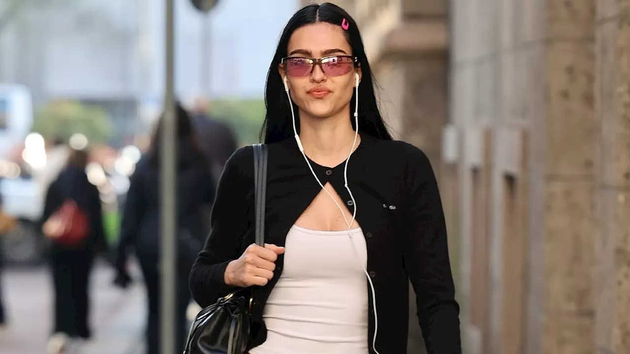 Amelia Gray Hamlin puts on an edgy Y2K display in low-waisted jeans and busty tank top in Milan