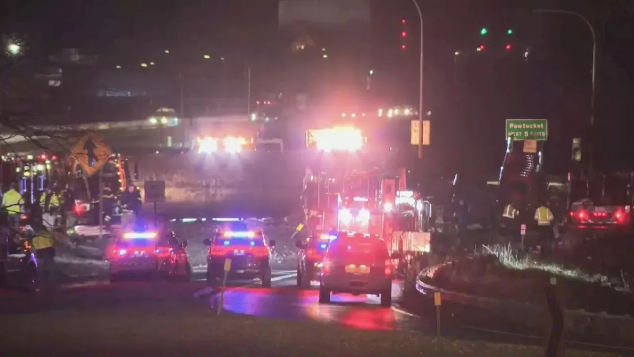 Tractor-trailer carrying 18 cars rolls over on I-95 in Providence, RI