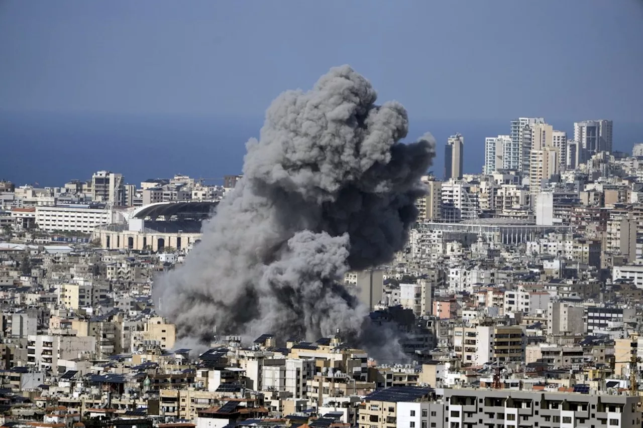 Israeli strikes set off explosions in Beirut suburbs and kill 14 Palestinians in Gaza, medics say