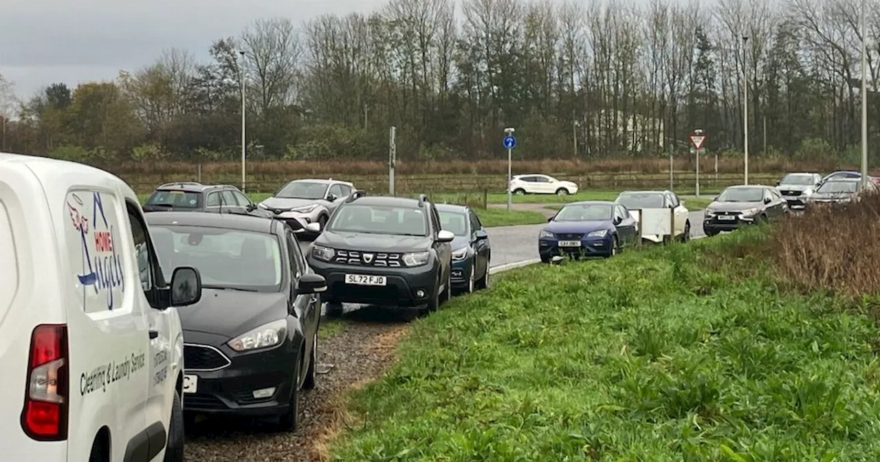 Hospital parking overspill forcing drivers to park on grass verges