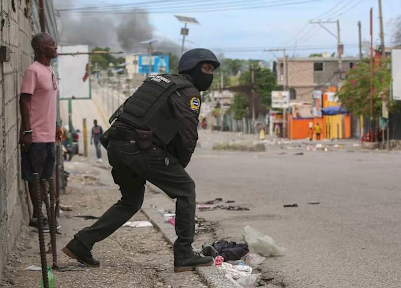 Haiti's main airport and capital frozen after a day of violence