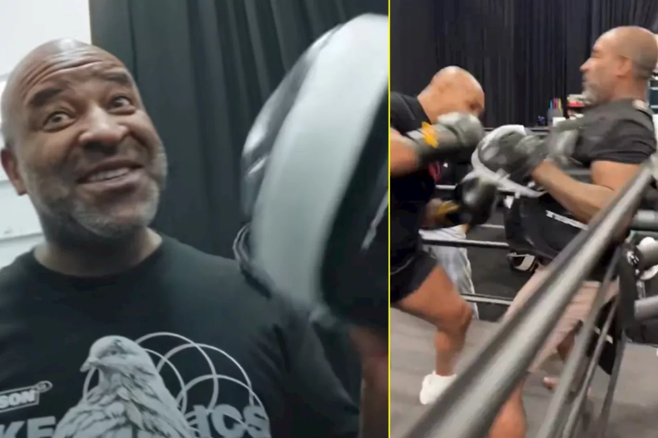 – Mike Tyson leaves trainer visibly stunned as he breaks pad in half with power in...