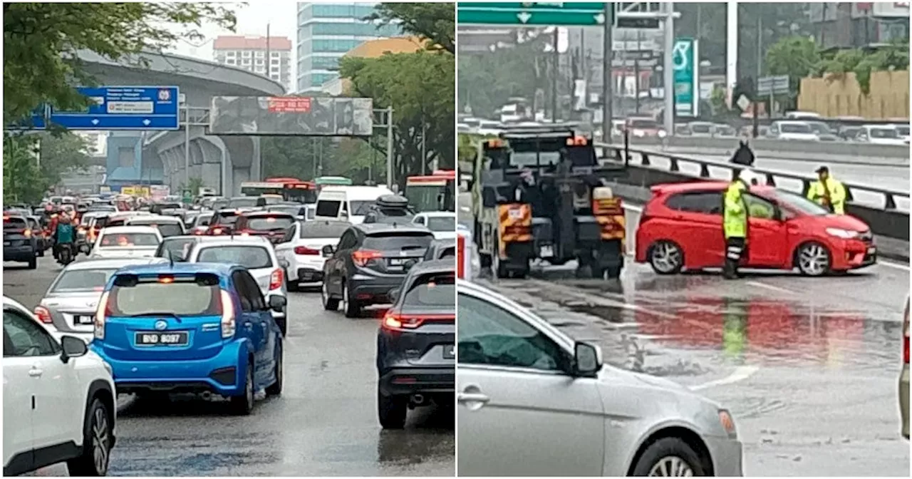 Heavy Downpour During Morning Rush Hour Causes Massive Jam in Damansara, Cars Trapped in Floodwaters