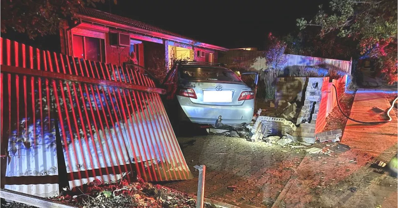 Man arrested after allegedly crashing into parked car and fence in Adelaide