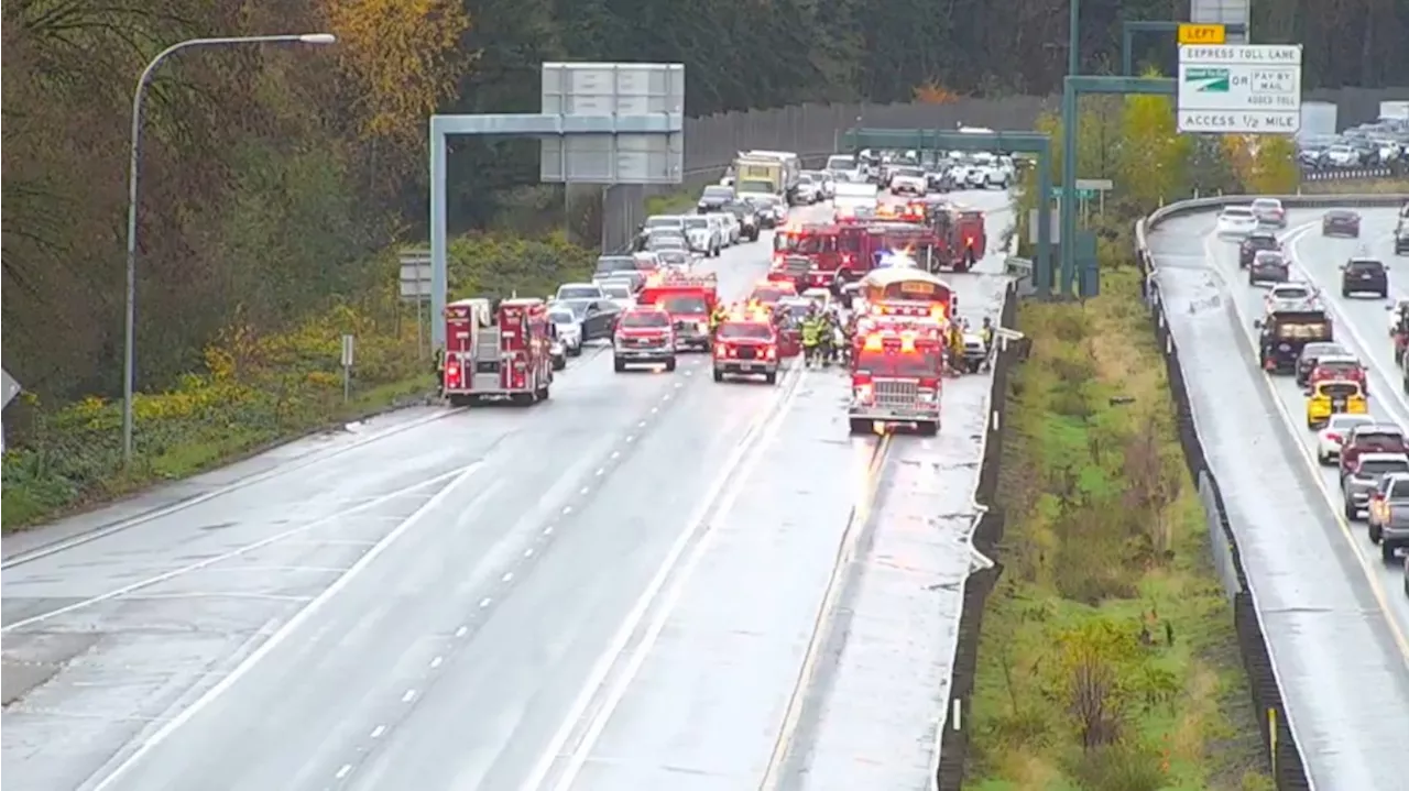 Collision involving a school bus blocks most of I-405 south in Bothell