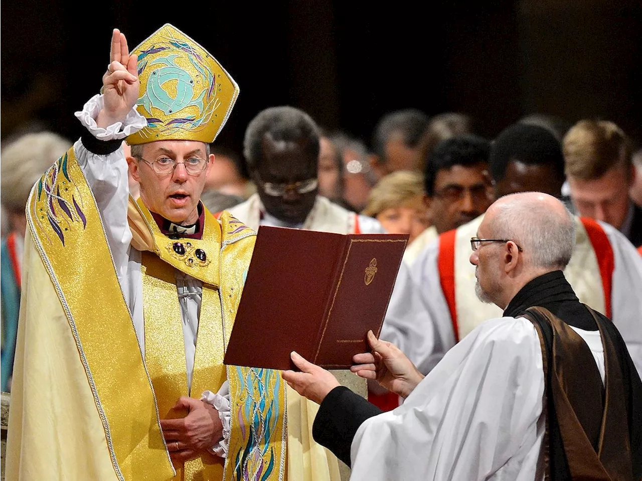 Church of England faces pressure over abuse scandal after archbishop quits