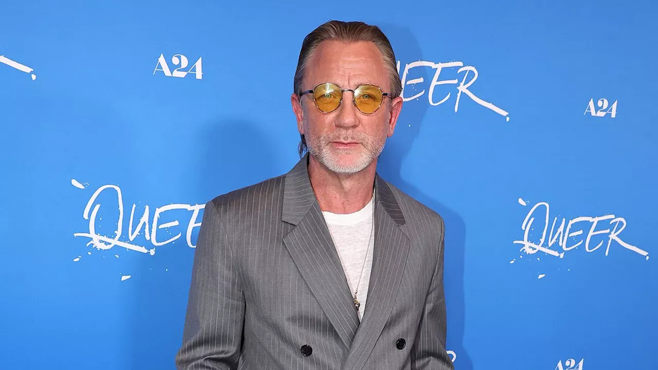 Daniel Craig, 56, is a silver fox in grey Loewe suit at Queer premiere in LA