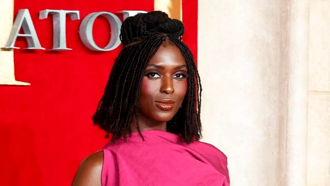 Jodie Turner-Smith puts on a leggy display in a hot pink mini dress as she joins glamorous Una...