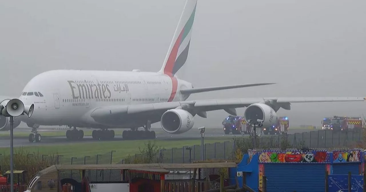 Fire crews surround plane on runway at Manchester Airport after 'loud bang'