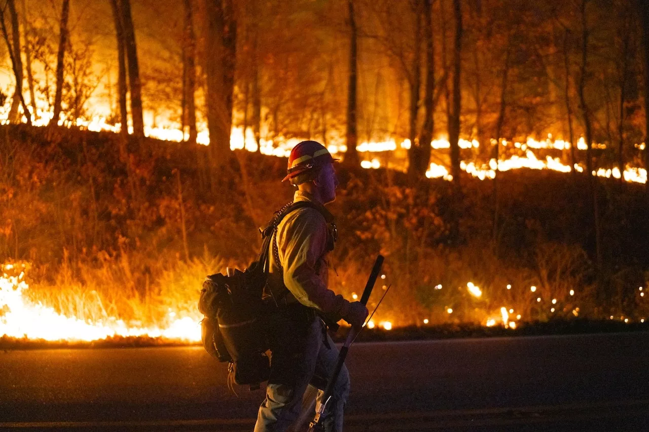 2 charged with setting blazes as crews battle wildfires in Northeast