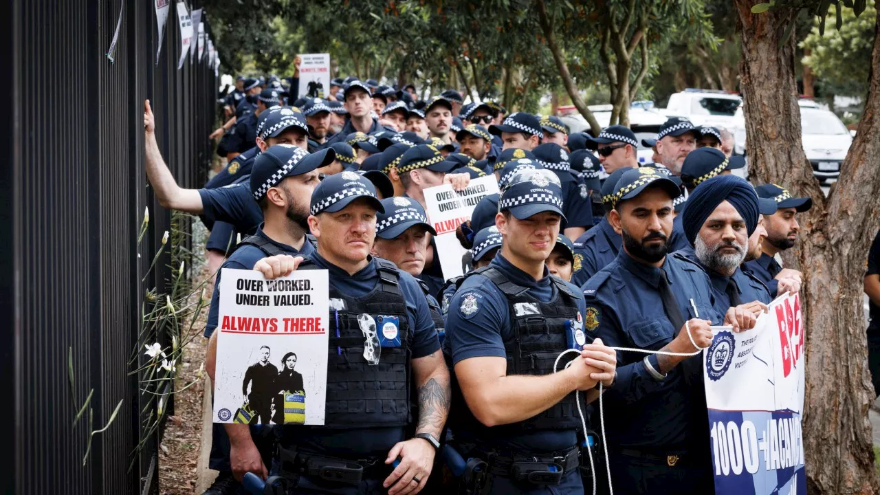 Hundreds of police walk off the job as pay dispute escalates