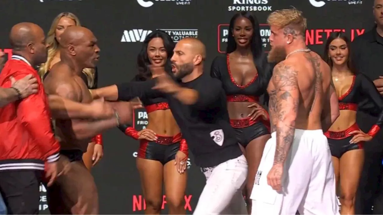 Mike Tyson hits Jake Paul in the face during weigh-in staredown ahead of historic bout