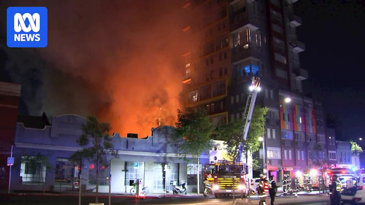 Residents evacuated from West Melbourne hi-rise after 'suspicious' fire engulfs empty warehouse