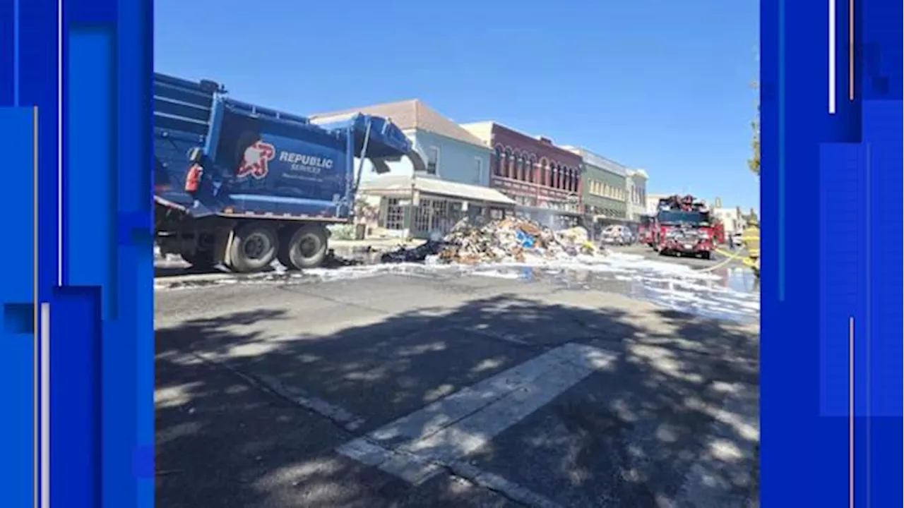 Trash truck dumps burning load, closes busy street in Seguin