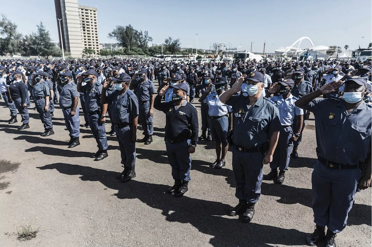 Police make community rescuers at Stilfontein sign indemnity forms before helping trapped miners