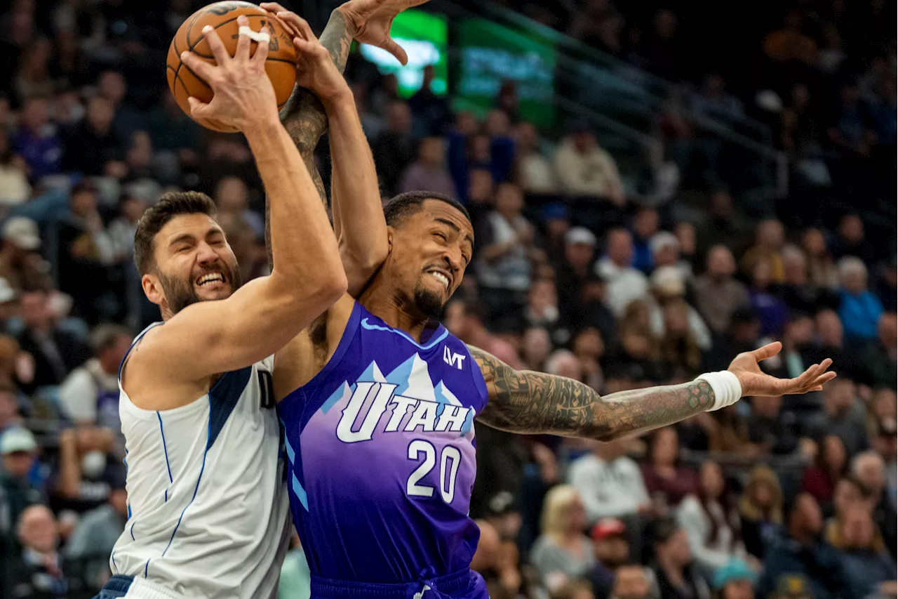 John Collins scores on a late dunk to lift Jazz past Mavericks for 1st home victory