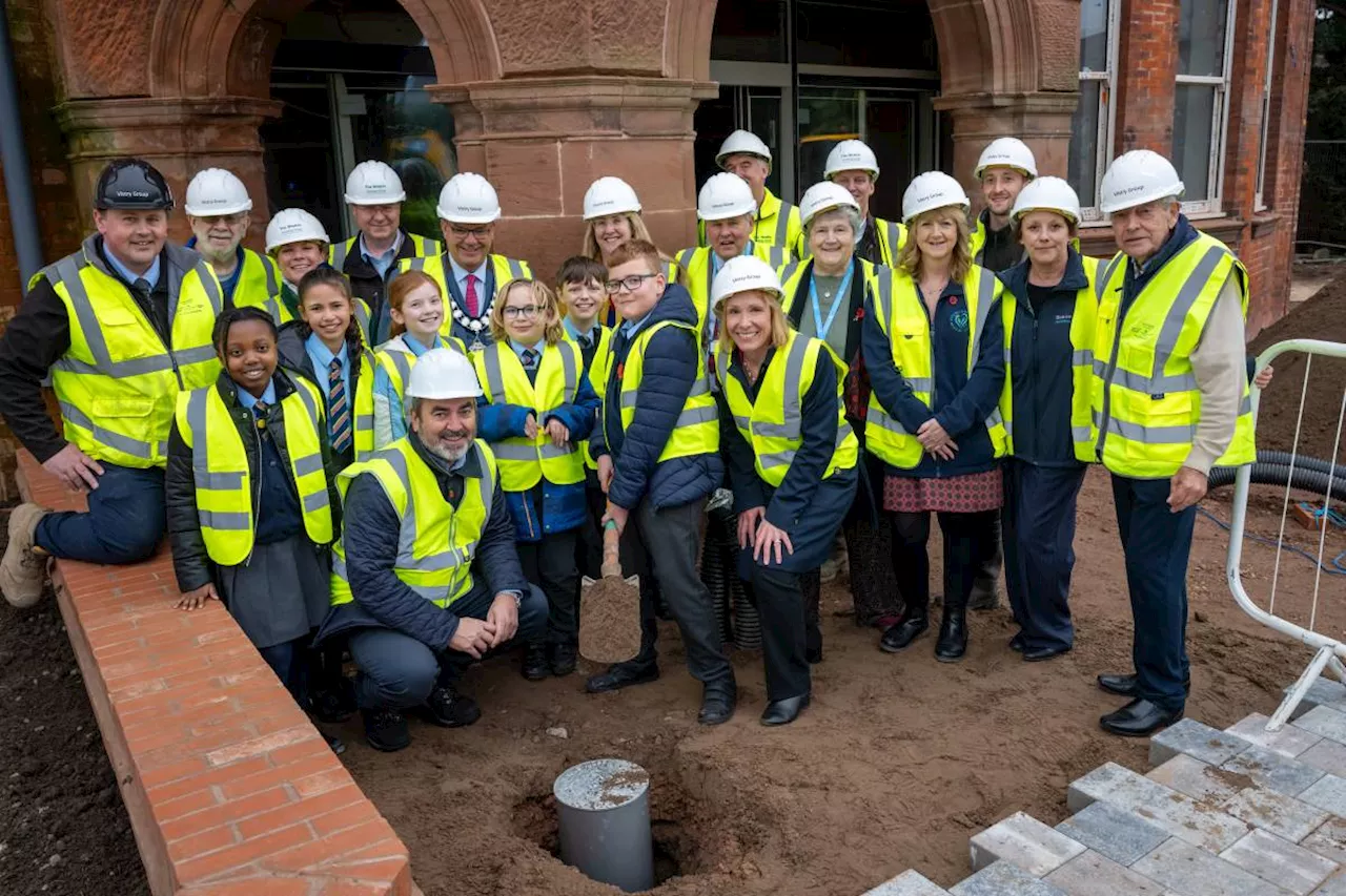 Community comes together to bury time capsule at flagship housing and health hub