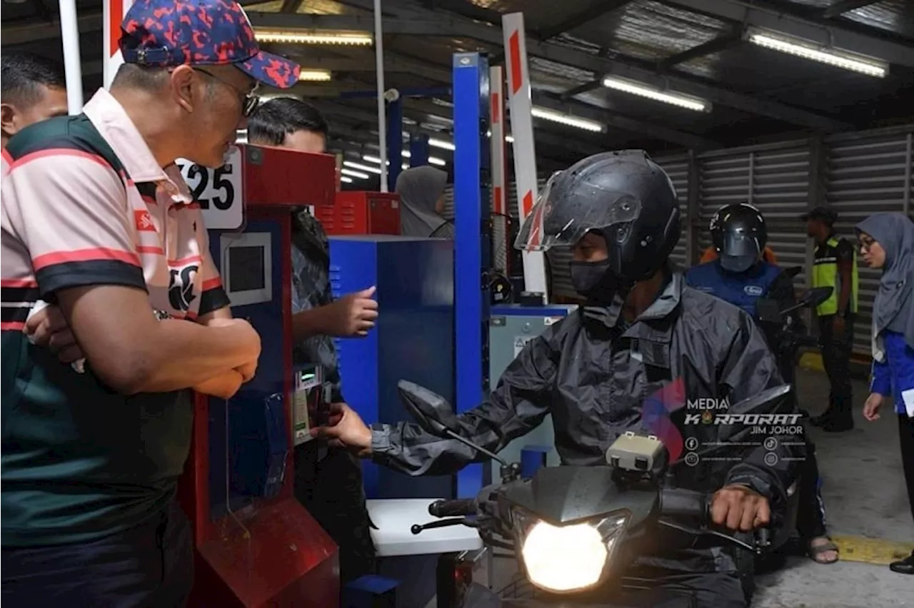 Malaysia officials clamp down on errant motorcyclists at Johor’s CIQ