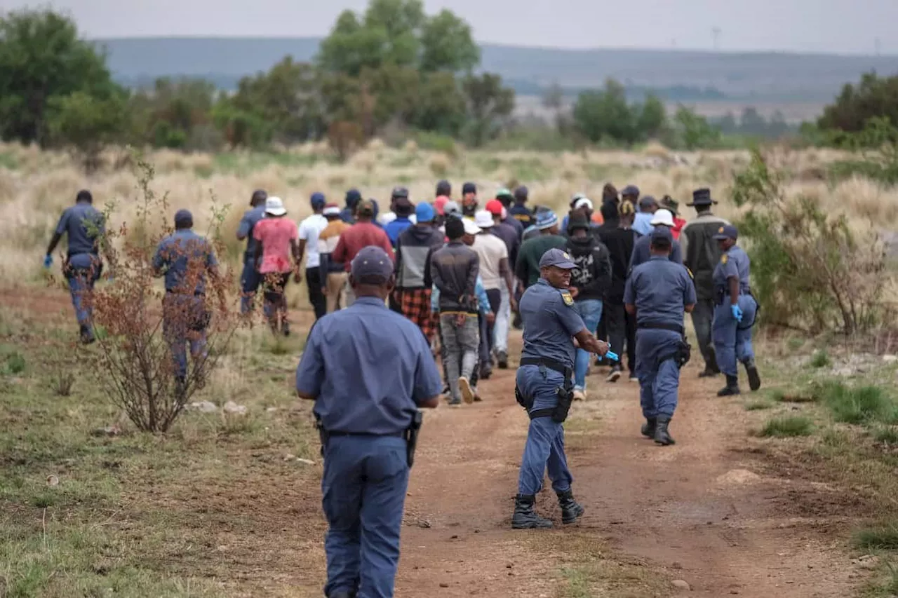 Police ‘not backing down’ as estimated 400 illegal miners ‘refuse’ to resurface