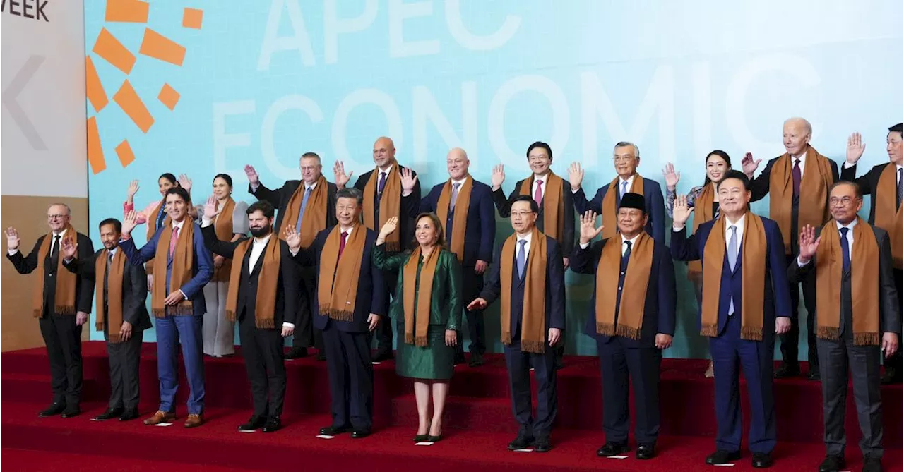 World leaders snapped in 'family photo' at APEC summit ahead of Trump presidency