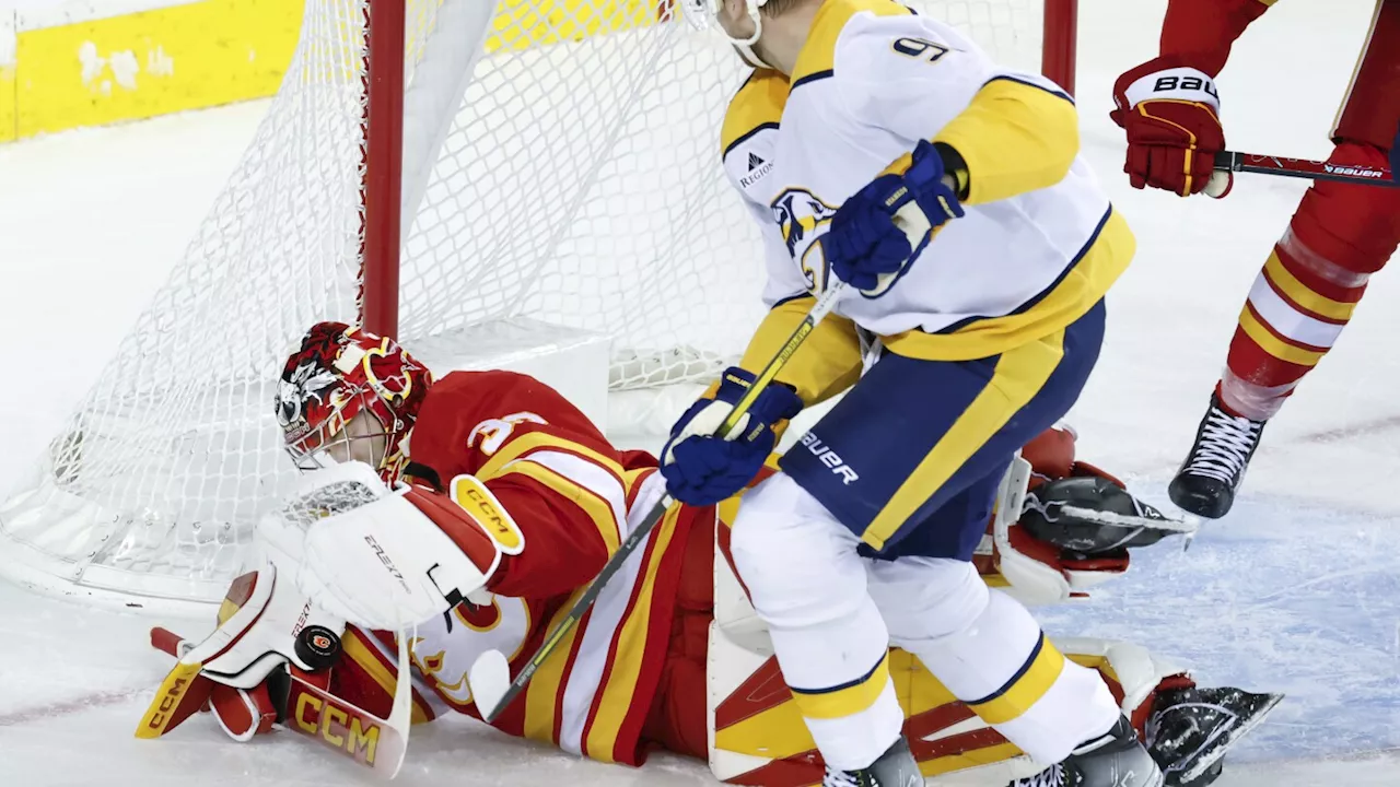 Wolf makes 29 saves for first career shutout as Flames beat Predators 2-0