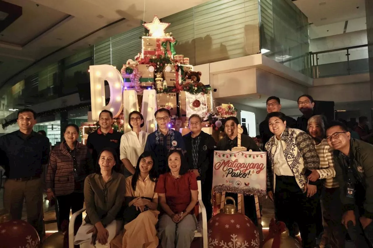 DMW opens Christmas bash with 'balikbayan box' tree