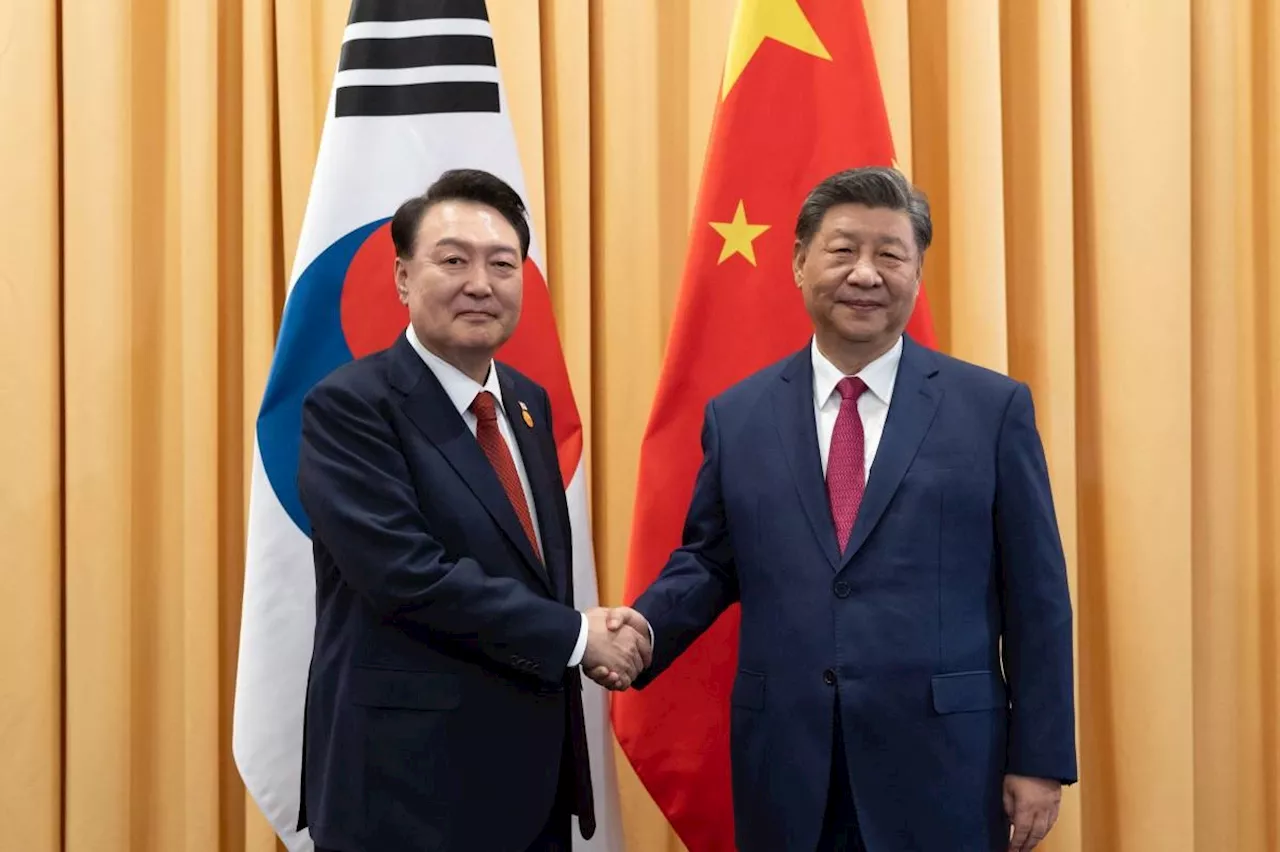 SKorea, China leaders hold rare meeting, pledge cooperation