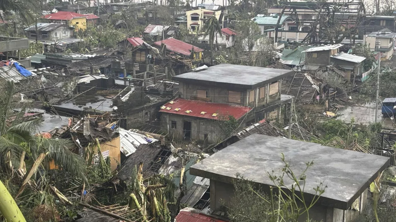 Latest typhoon batters the Philippines, causing tidal surges and displacing about 400,000 people