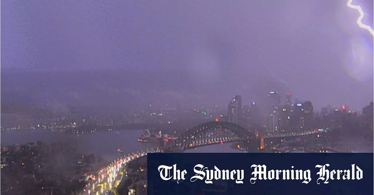 Cars damaged when storm dislodged Harbour Bridge road plate