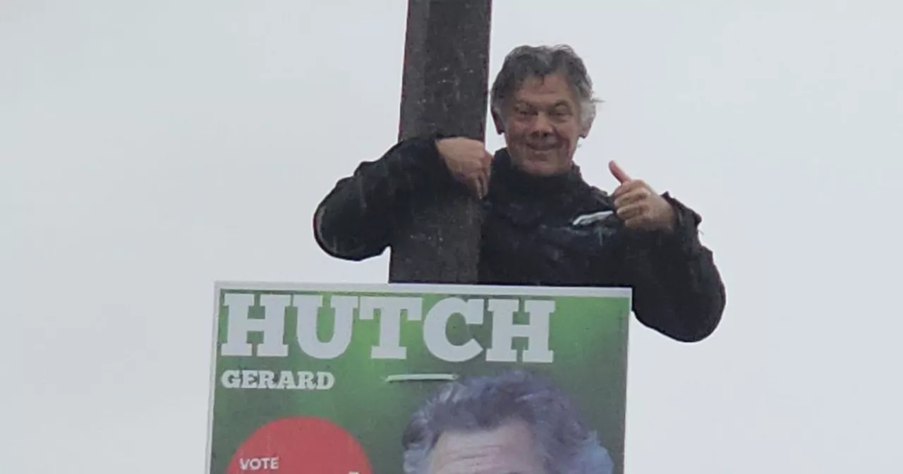 Gerry 'The Monk' Hutch gives thumbs up as he puts up election posters in Dublin