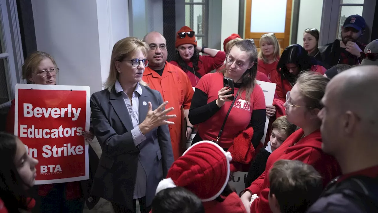 Striking Massachusetts teachers rally on Statehouse steps