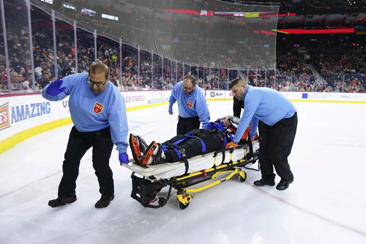 NHL referee Mitch Dunning communicative, can move extremities following violent collision