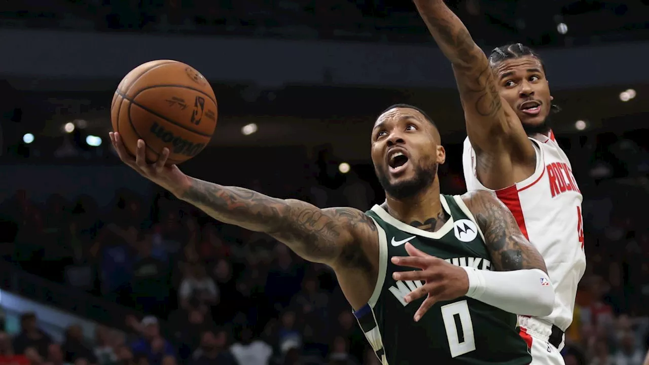 Bucks' Damian Lillard makes winning layup in return from concussion