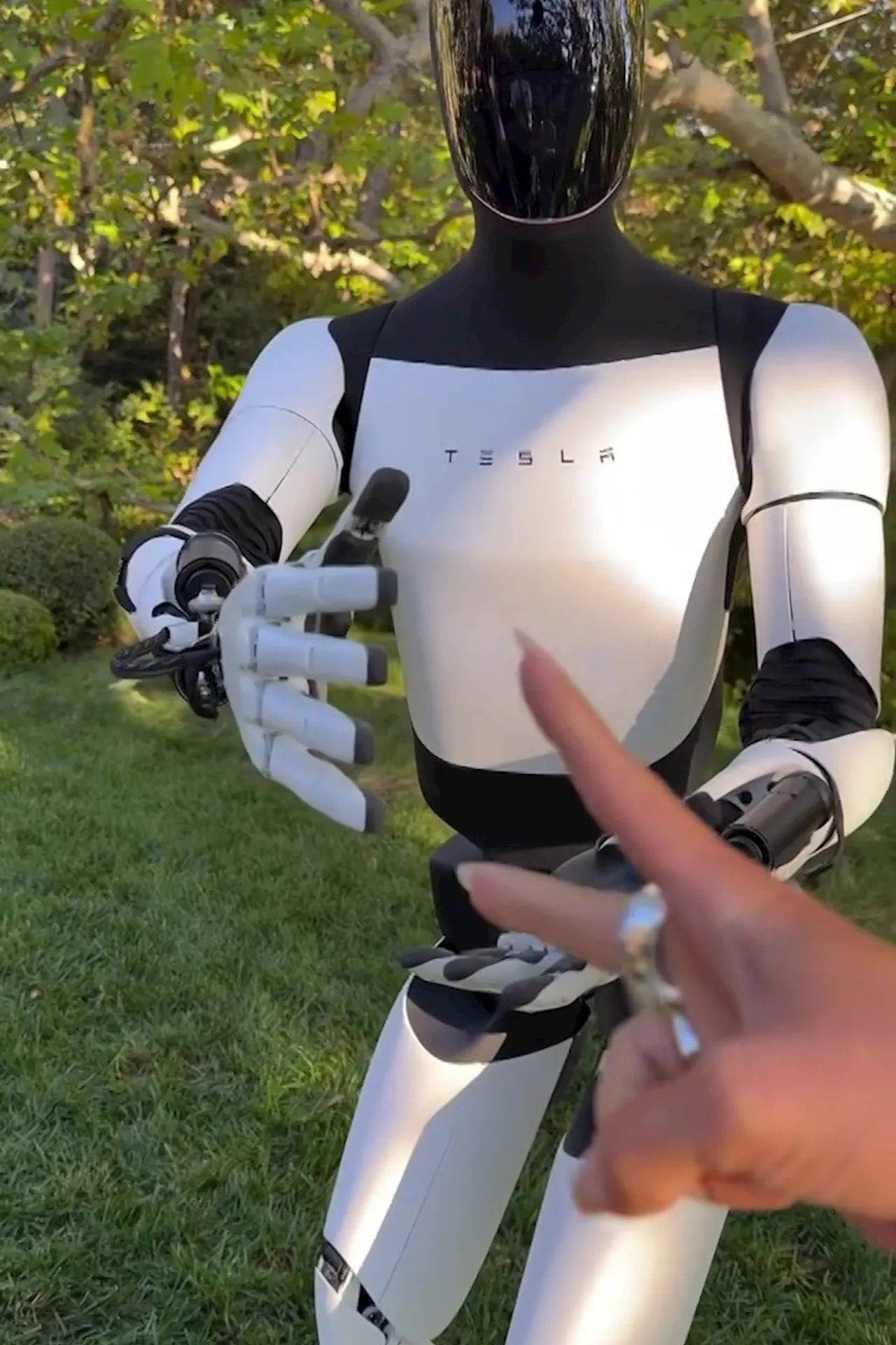 Watch Kim Kardashian beat Tesla Optimus at rock-paper-scissors & let it drive Cybercab as she’s FIRST to r...